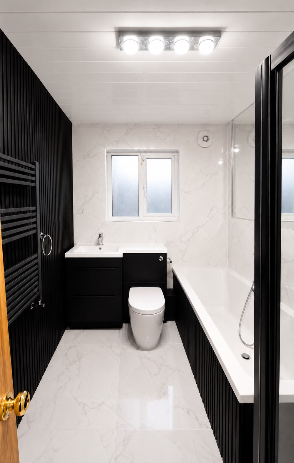 Monochrome marble bathroom with black slatted feature wall and black vanity unit